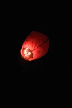Low angle shot of a floating lantern isolated on a black background Stock Photos