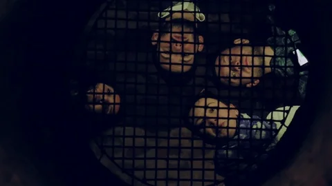 Low angle shot of four talking young people through the bars. Cheerful mood 스톡 동영상 105271922