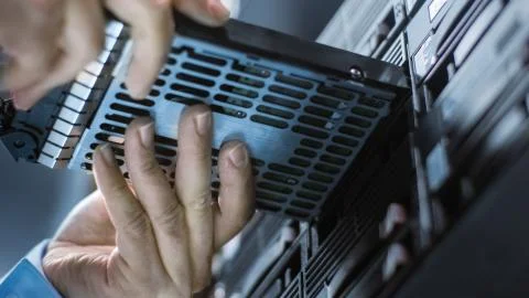 Low Angle Shot In Fully Working Data Center IT Engineer Installs Hard Drive i Stock Photos