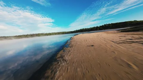Low angle shot gliding across misty lake Stock Footage 340904335