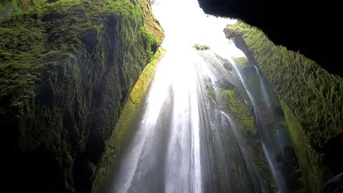 Low angle shot of Gljufrabui waterfall plunging from a hidden gorge, 4K Stock Footage 334808991