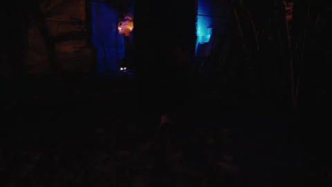 In a low-angle shot, a gorgeous witch woman walks around a magical church Stock Footage 259789270