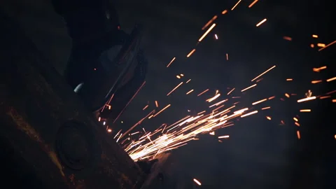 Low angle shot grinding machine operates with metal detail Stock Footage 101045950