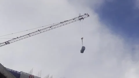 Low-angle shot of a heavy-duty tower crane lifting. Stock Footage 334849192