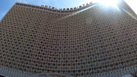 Low-angle shot of the iconic Hotel Uzbekistan facade in Tashkent Stock Footage 335034680