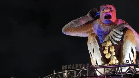 Low angle shot of iconic Nasalis larvatus statue with colorful lights at night Stock Footage 105550018