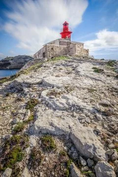 Low angle shot of la Madonetta lighthouse in Bonifacio in Southern Corsica Stock Photos