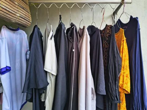 Low-angle shot of laundry hanging to dry on a metal rack. Fotos Stock