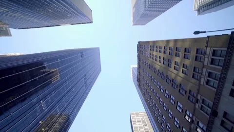 Low angle shot looking up at modern glass and classic brick skyscrapers 库存影片 342897272