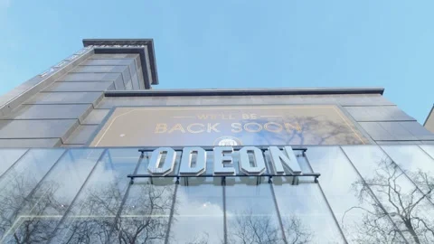 Low angle shot looking up towards Odeon Cinema in Leicester Square London Stock Footage 148616936