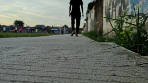 Low angle shot of man feet running and jogging at sunset Stock-Footage 325613030