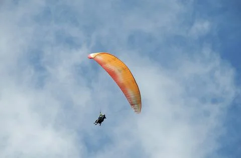 Low angle shot of a man paragliding during daylight, in France Stock-Fotos
