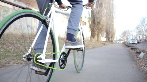 Low angle shot of man riding sport bicycle on a street, healthy outdoor activity Stock Footage 132673987