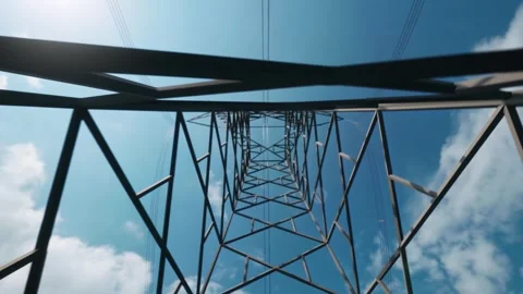 Low Angle Shot of Metal Power Transmission Tower Against Blue Sky 動画素材 339079648