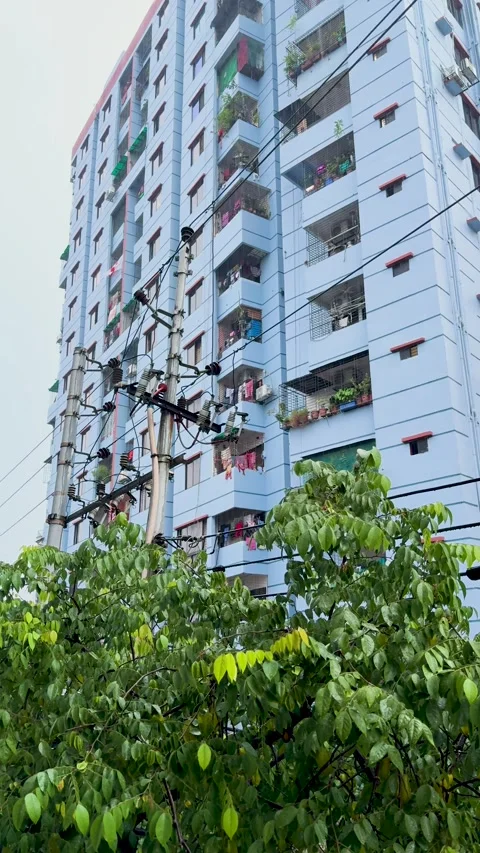 Low angle shot of a modern blue apartment building with hanging clothes and.. Stock Footage 337788561
