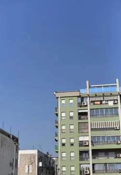 Low-angle shot of a modern green apartment building rising Stock Photos