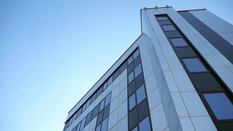 Low-angle shot of a modern office building with glass windows Stock Footage 302744955
