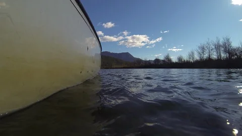 Low angle shot of a moving canoe in calm water Stock Footage 90023198
