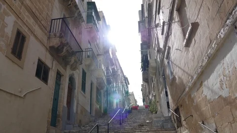 Low angle shot of a narrow street with flair lighting Stock Footage 90309331