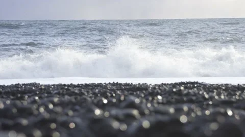 Low angle shot of the ocean at the black sand beach in Iceland Video stock 137863571