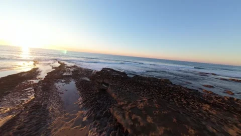 Low angle shot of ocean waves at golden hour Stock Footage 344556165