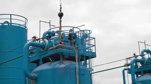 Low Angle Shot of oil and gas workers performing tasks Stock Footage 45236761