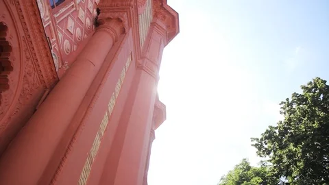 Low angle shot of an old baroque theatre constructed of red bricks under the Stock Footage 99603445