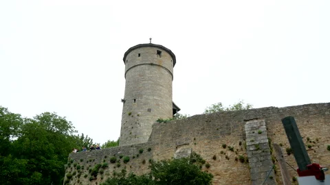 Low angle shot of old historic castle tower in Rothenburg, Germany during clouds Video stock 139605841