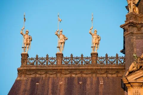 Low angle shot of old statues on top of a City hall building in Paris, France Stock Photos
