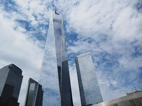 Low-angle shot of One World Trade center tower from the Memorial with reflection Stock Photos