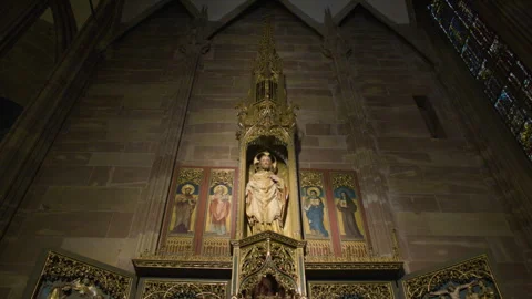 Low angle shot of an ornate gilded altar in gothic cathedral 스톡 동영상 315409799