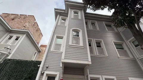 Low angle shot of a Ottoman-style wooden house with bay windows and lattice Vídeos de archivo 340155108
