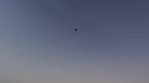 Low Angle Shot of Paratroopers Jumping From an Aircraft Stock Footage 128553348