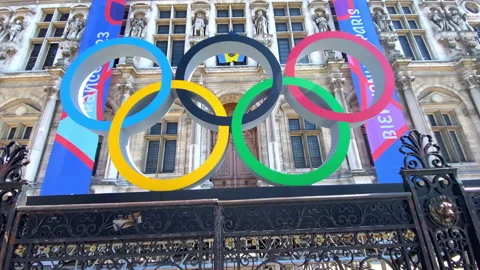 Low angle shot of Paris 2024 Olympic rings at the entrance of the city hall  Stock Footage 266886544