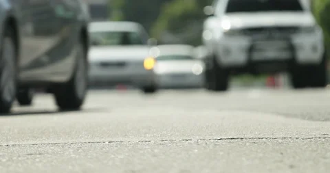 Low Angle Shot Of Passing High Speed Cars and Traffic 動画素材 128683000