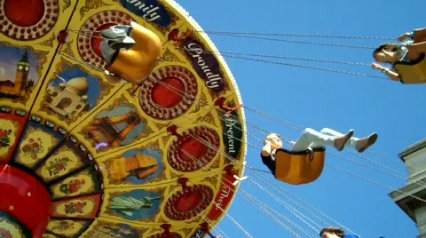 Low Angle shot of People on Fair Ground Ride against Blue Sky, feat music 스톡 동영상 815165
