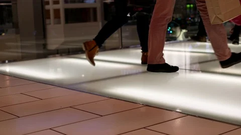 Low angle shot of people walking at food court area Video stock 70475434