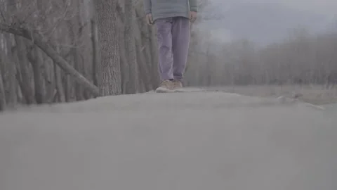 Low-angle shot of a person walking on a concrete ledge in winter Stock-Footage 327595388