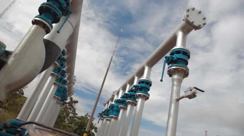 Low Angle Shot of Pipes and Equipment at an oil and gas Well Stock Footage 45236720