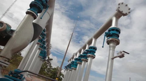 Low Angle Shot of Pipes and Equipment at an oil and gas Well Stock Footage 45236746
