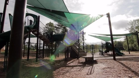 Low Angle shot of Playground with  Lens Flare Slow Track Stock Footage 84521329
