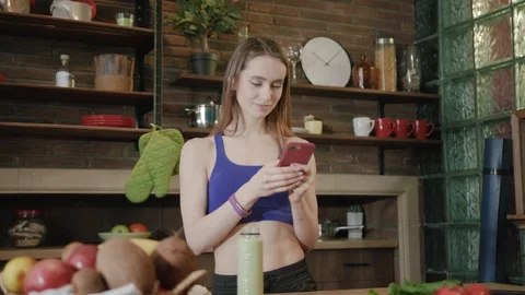 Low angle shot of pretty smiling young woman in fitness wear, getting ready for Stock Footage 111959629
