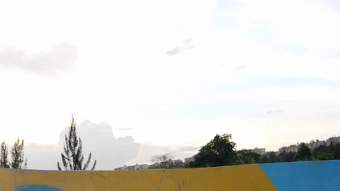 Low angle shot of a professional young boy jumping on the ramp with rollerblades Stock Footage 110914564