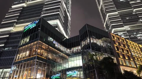 Low angle shot Raffles City glass building at night Shanghai May 31, 2024 스톡 동영상 323153901