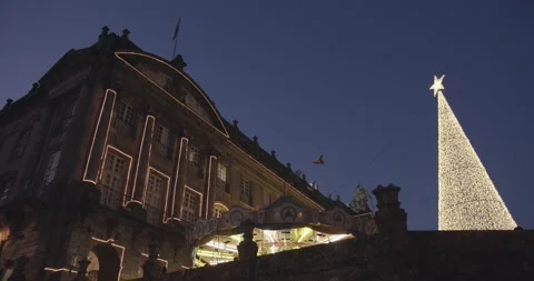Low angle shot of Raxoi palace and Christmas light tree on Christmas time 스톡 동영상 140583528