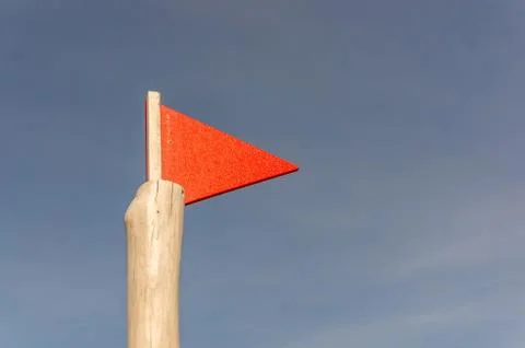 Low angle shot of a red triangular flag 写真素材