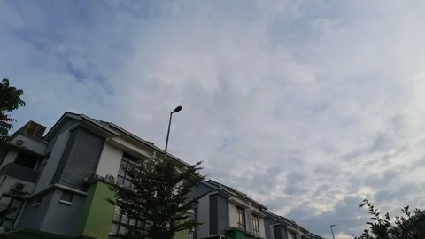 Low angle shot of residential terrace houses under a cloudy morning sky. Stock Footage 340877657