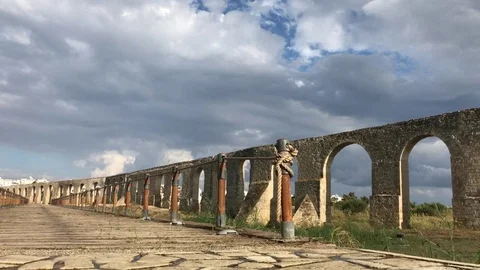 Low Angle Shot of Roman Aqueduct and Wooden Path in Larnaca, Cyprus Stock Footage 89727997