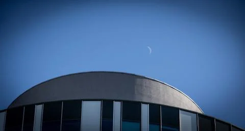 Low angle shot of a round shape building on blue sky background Fotos de archivo