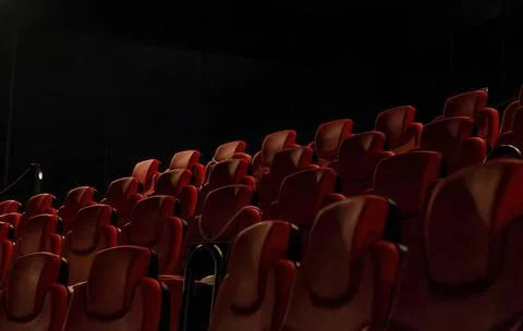 Low angle shot of rows of red chairs in a cinema hall Stock Photos